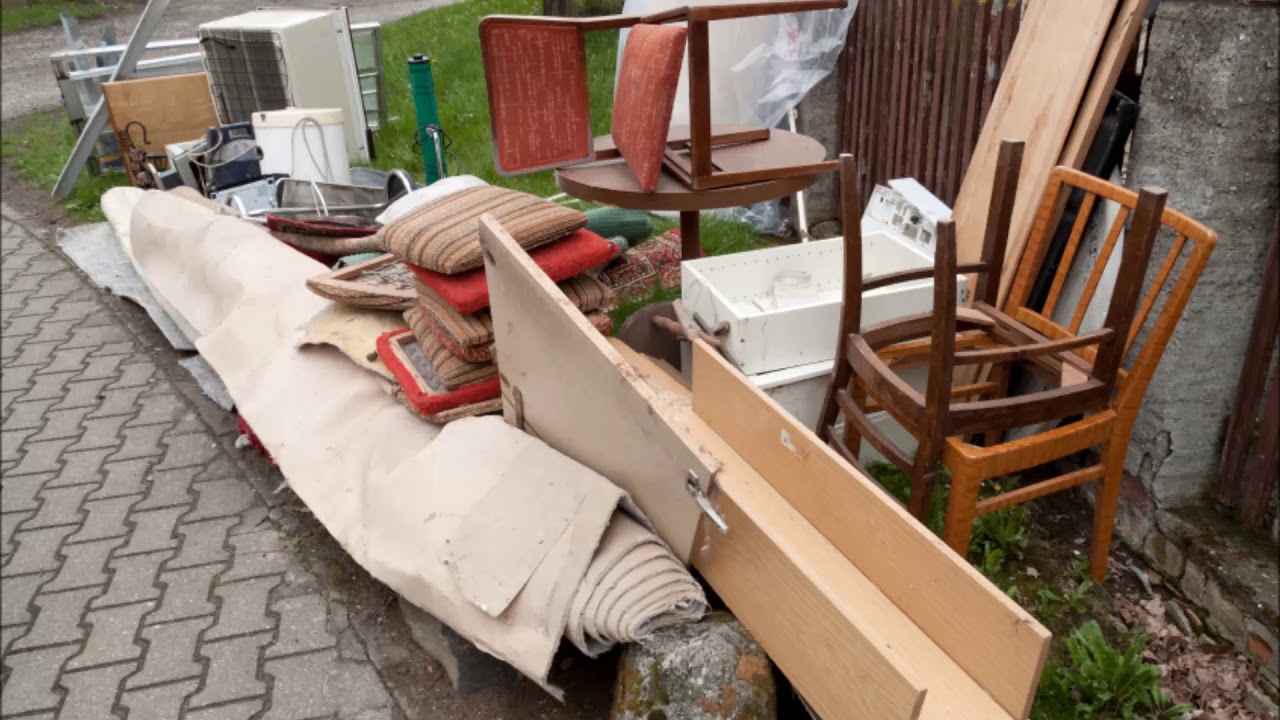 junk removal truck loading waste